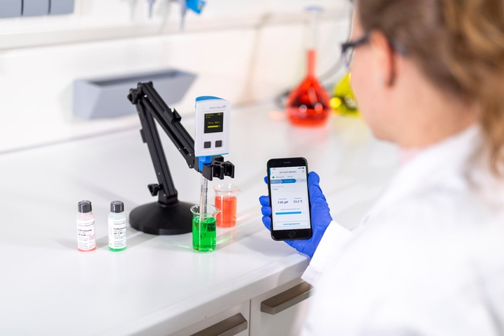 Laboratory employee examining grab samples in the lab